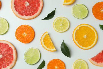 Flat lay with citrus slices on white background