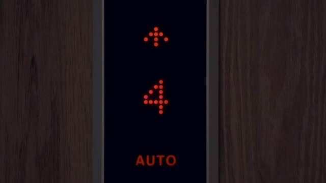 Elevator numbers on a black background. Changing numbers and a moving elevator panel to different floors in a high-rise building.