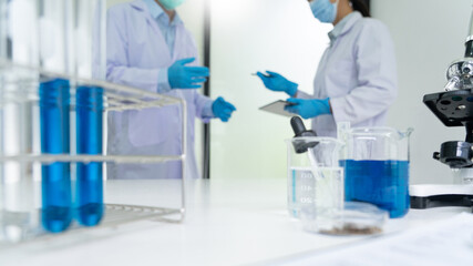 Fototapeta premium Team of Medical Research Scientists or researcher in lab coat testing their experimental in Modern laboratory.