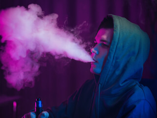 vape man, exhales a cloud of steam, neon light portrait.