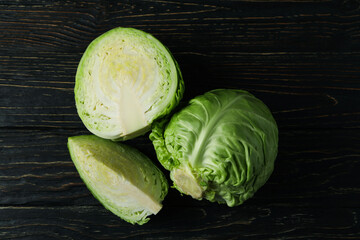 Fresh green cabbage on wooden table, top view