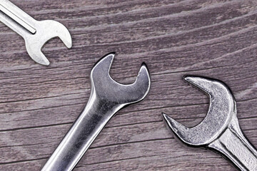 wrenches on a wooden background