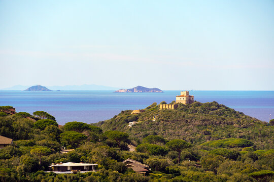 Italy Tuscany, Punta Ala, Rio Palma Path, Mountain Bike MTB E-MTB, Panoramic view of the port of Punta Ala, the castle, rocks of porcs and the sparrow, in the background The Elba and Capraia island