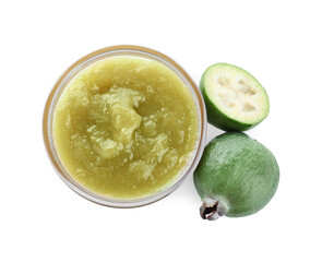 Feijoa jam in glass bowl and fresh fruits on white background, top view