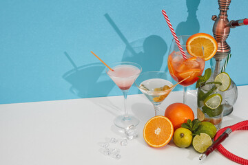 Hookah (shisha) and cocktails set on double white blue background with shadow. Copy space. Hookah bar, cocktail bar