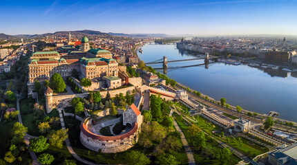Budapest, Hungary - Aerial panoramic skyline view of Buda Castle Royal Palace with Szechenyi Chain Bridge, St.Stephen's Basilica, Parliament of Hungary and Matthias Church on a summer morning
