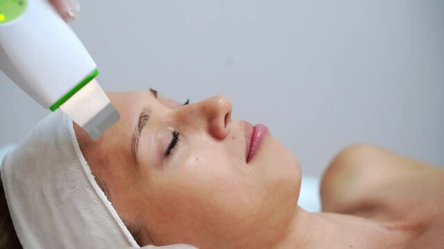 Ultrasonic skin equipment. Woman face cosmetology treatment. Female clinic facial procedure. Anti acne surgery cleaning. Dermatology spa mask. Detox therapy. Rejuvenation skincare beauty. Copyspace