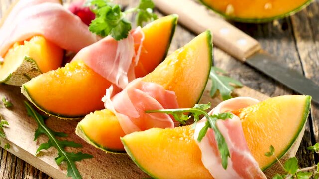 melon with prosciutto ham and raspberry