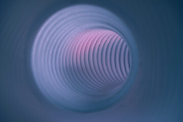 Beautiful round abstract tunnel with color light on a background pattern textured ford design.