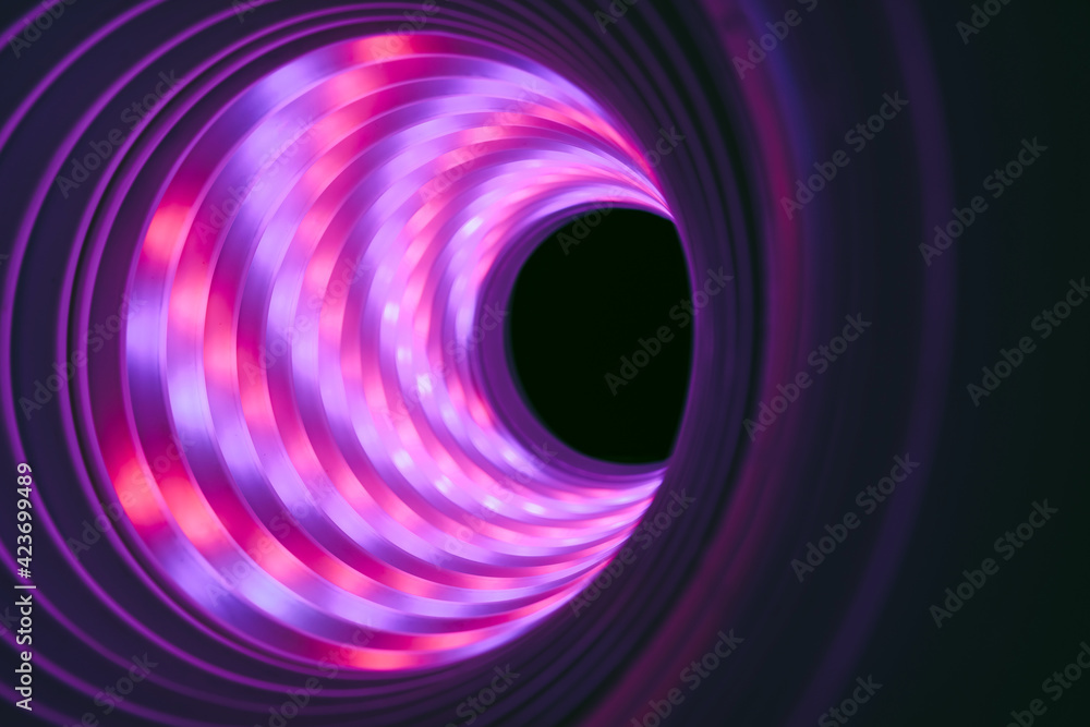 Aufkleber beautiful abstract swirl tunnel with purple neon light on a background pttern textured for deisgn.