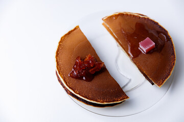Stack of Tasty pancakes on white background