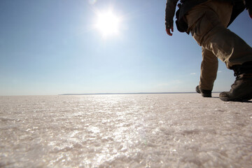 Man walking by the salt lake
