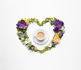 Obraz na płótnie Canvas Beautiful heart made of different flowers and coffee on white background, top view