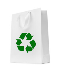 Paper shopping bag with recycling symbol on white background