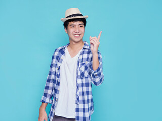 Handsome men pointing on blue background