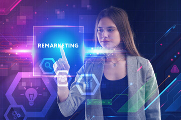 Business, Technology, Internet and network concept. Young businessman working on a virtual screen of the future and sees the inscription: Remarketing