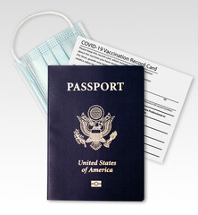 COVID-19 Vaccination Record card with US Passport and medical or surgical mask isolated on white background including clipping path. Immune passport or certificate.