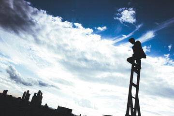 A man climbs the stairs to the sky