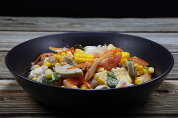 Traditional spicy mixed salad serving on the plate. Famous appetizer menu in Asian restaurant. 