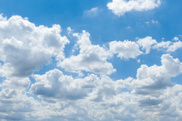 Beautiful blue sky with whipped white clouds that are illuminated by the sun