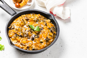 Homemade mushroom gravy in cast iron skillet. Space for text.