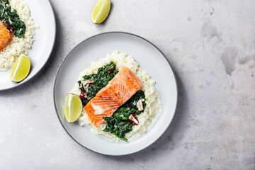 Salmon fillet with rice and spinach garnish