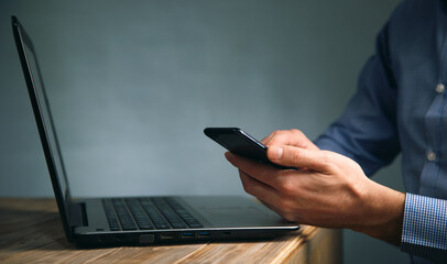 businessman working on computer and phone