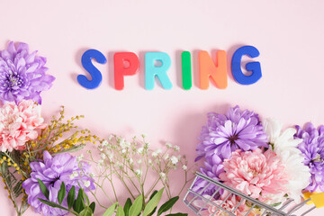 Obraz premium inscription spring in flowers on a pink background