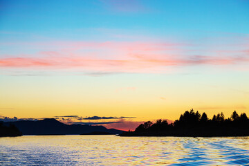 Sunset over the copeland Islands from a boat from Lund on the strait of Georgia