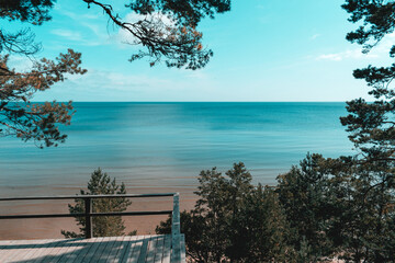 The Evazi bluff or steep by the Baltic Sea in Latvia during sunny summer day. Blue sky, blue sea,...
