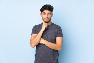 Arabian handsome man over isolated background and thinking
