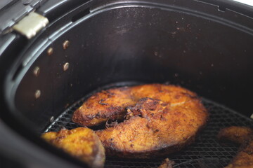 Cobia fish inside the air fryer. In India it is called Moda fish