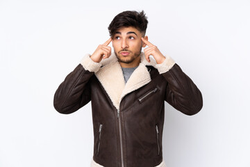 Arabian handsome man over isolated background having doubts and thinking