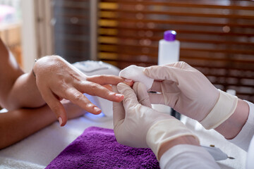 Woman doing manicure in the beauty salon