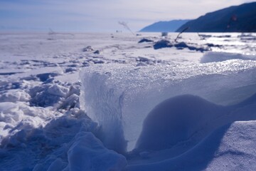 Landscape with snow.  Winter on the lake Baikal