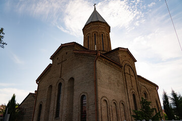 Fototapeta na wymiar Georgian church against the background of a beautiful sky