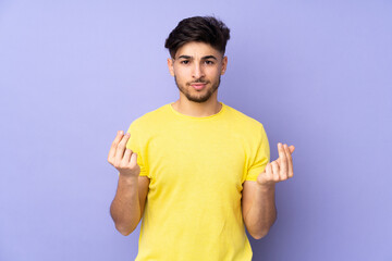 Arabian handsome man over isolated background making money gesture