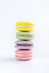 Stack of colorful macaroons on a white background