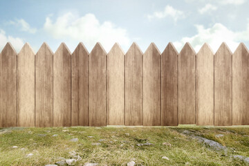 Fototapeta premium Wooden fence on the green garden