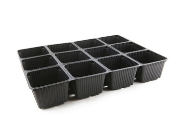 Empty plastic seedling tray isolated on white background. Plastic square plant pots for gardening.