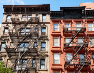 Old residential buildings with iron fire escapes, New York City, USA.