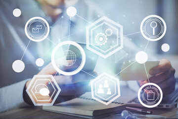 Double exposure of man's hands holding and using a phone and social network theme drawing.