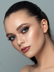 Naklejka premium Portrait of young woman with beautiful makeup