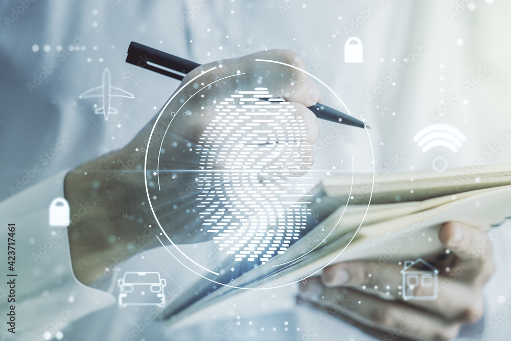 Poster Multi exposure of creative fingerprint hologram with man hand writing in notebook on background, personal biometric data concept