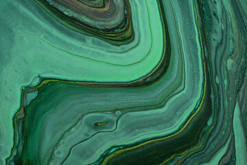 Abstract fluid art background green and black glitter colors. Liquid marble. Acrylic painting with emerald gradient.