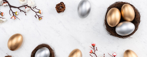 Design concept of Golden and silver Easter eggs in the nest with white plum flower.