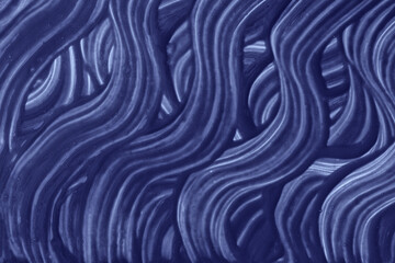 Abstract art background navy blue colors. Watercolor painting on canvas with indigo curly strokes and splash.