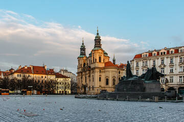 Fototapeta premium 25 000 crosses on Old Town Square as memory of COVID-19 virus victims.Life in pandemic.Empty city during lockdown.Historical, gothic style buildings at sunrise.Famous place unesco heritage square