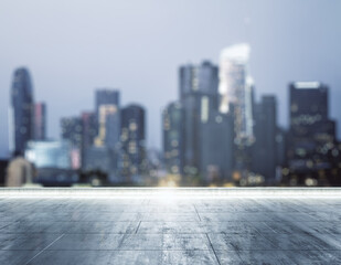 Empty dirty concrete rooftop on blurry background of a beautiful Los Angeles skyline at night, mock up