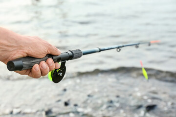 Man fishing in river, closeup